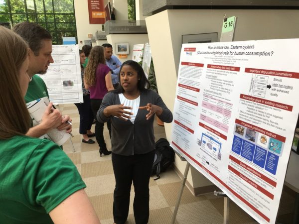 Vashti Campbell presents her research poster. 